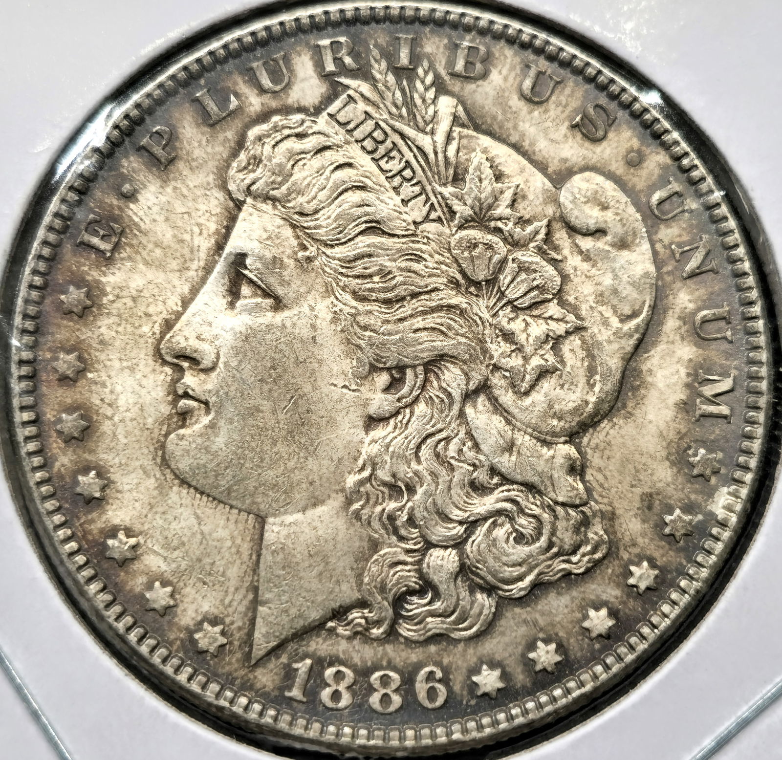1886 Morgan Silver Dollar Coin Toned Uncirculated Toned (1 of 2)