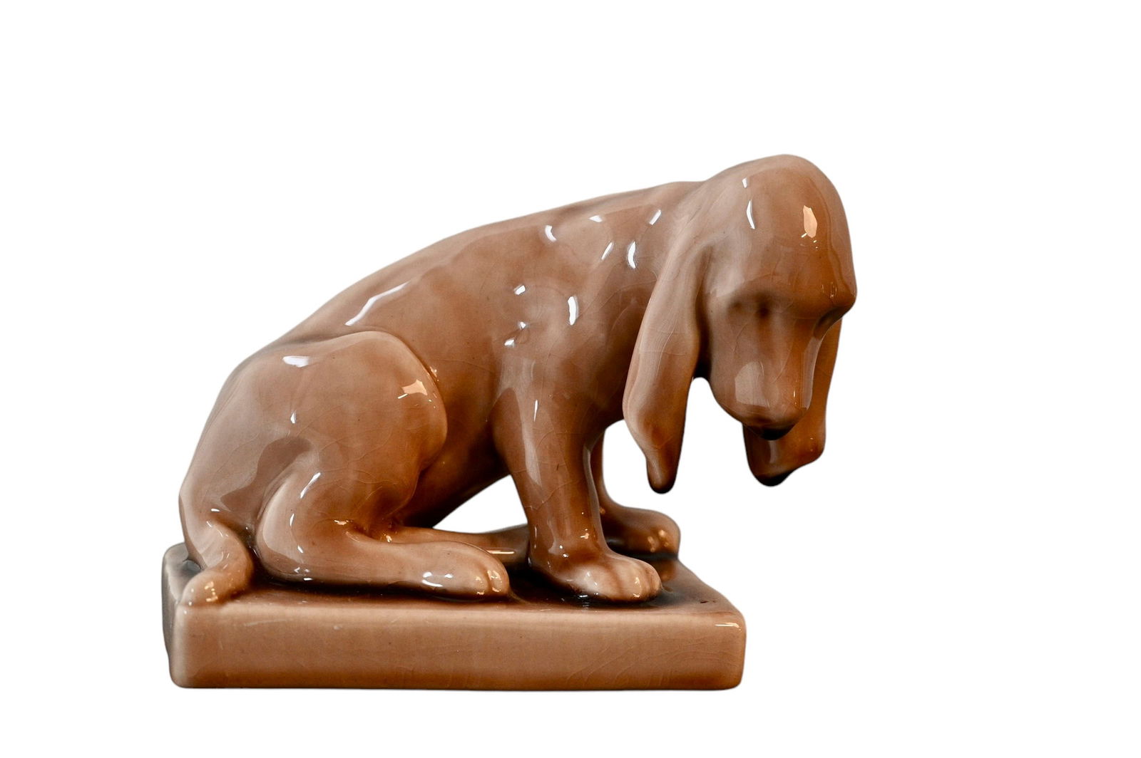 Rookwood Pottery Dog Bookend, #2998: Art pottery dog bookend. Dated 1948, RP logo and shape # 2998. 6w x 3 5/8d x 4 3/4h.