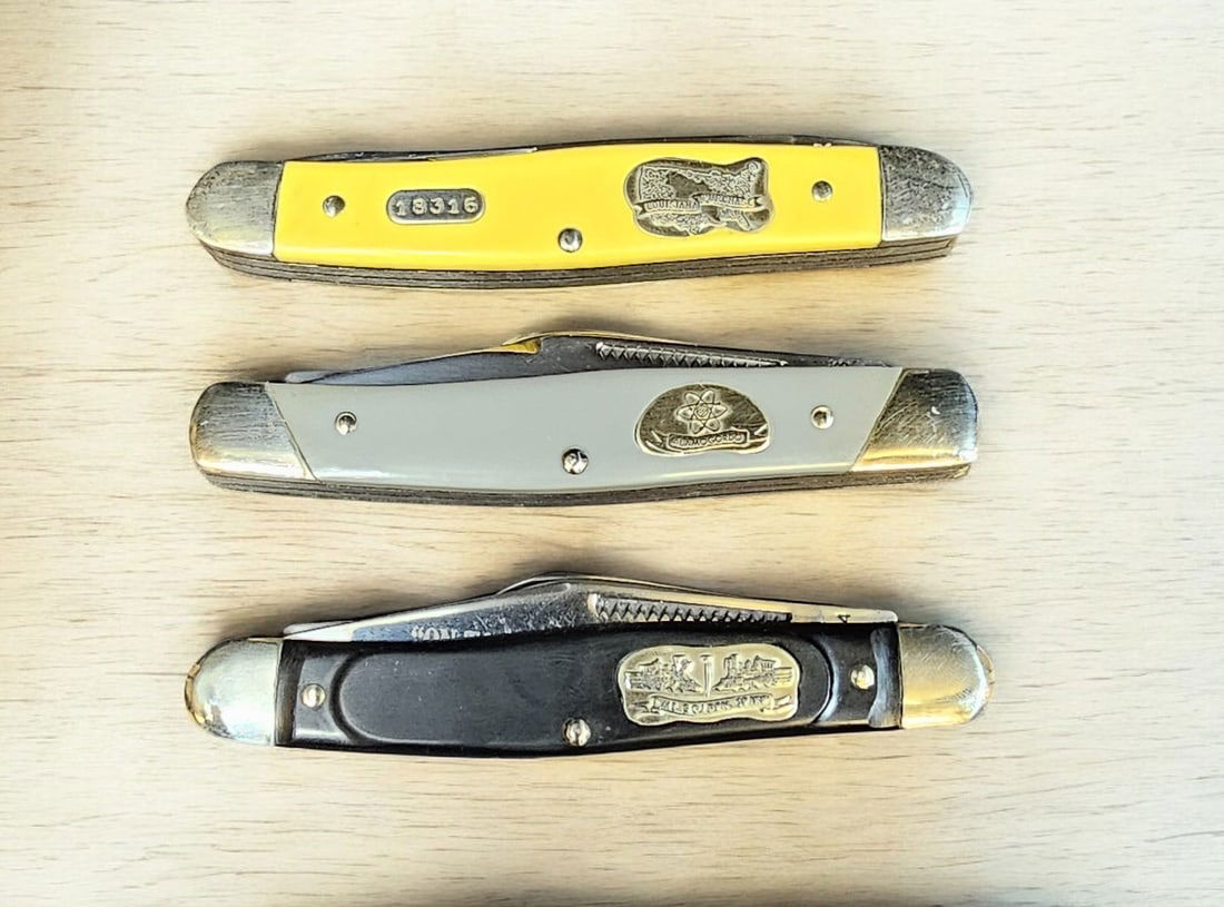 Boker USA Great American story 4 Knife Group: Boker USA Great American story Knife. With original box and papers. Model number 1783. Engraved on bade "Westward Expansion". (2) folding blades with cream color Delrin handle. Open: 7". Closed: 4".--