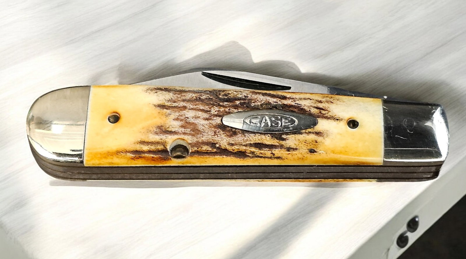 1980 Case 75th Anniversary Fat Stag Knife #5235: 1980 Case 75th Anniversary Fat Stag Knife #5235 1/2 SSP. Stainless steel blades with stag handle. Original "wrapping" paper. Open: 6", closed: 3 1/2".