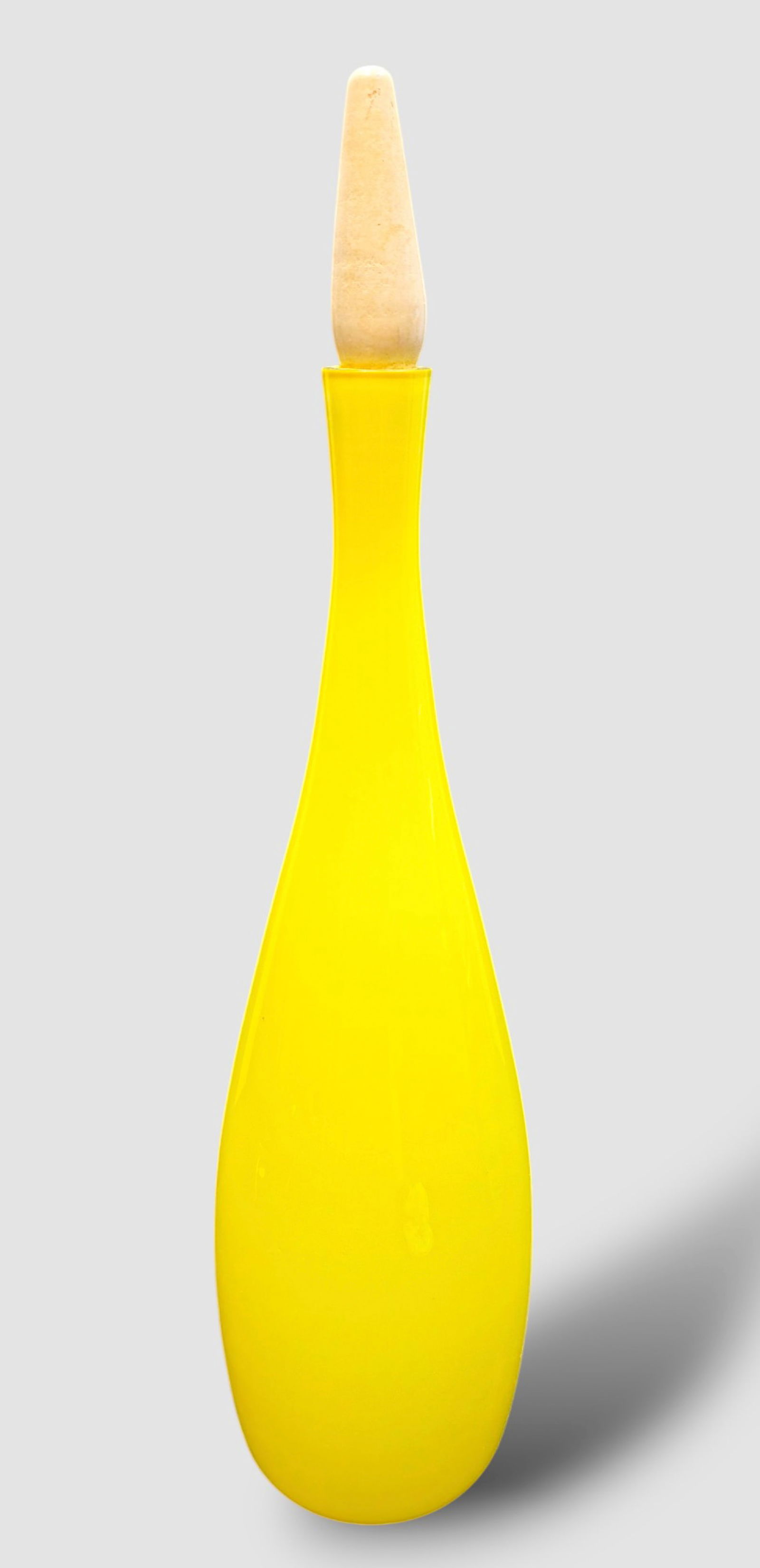 Arne Bang For Kastrup, Denmark Art Glass Bottle and Stoper: Yellow art glass bottle and stopper, Arne Bang, Kastrup, Denmark. Original Raymor paper label. 5"dia x 20"h.