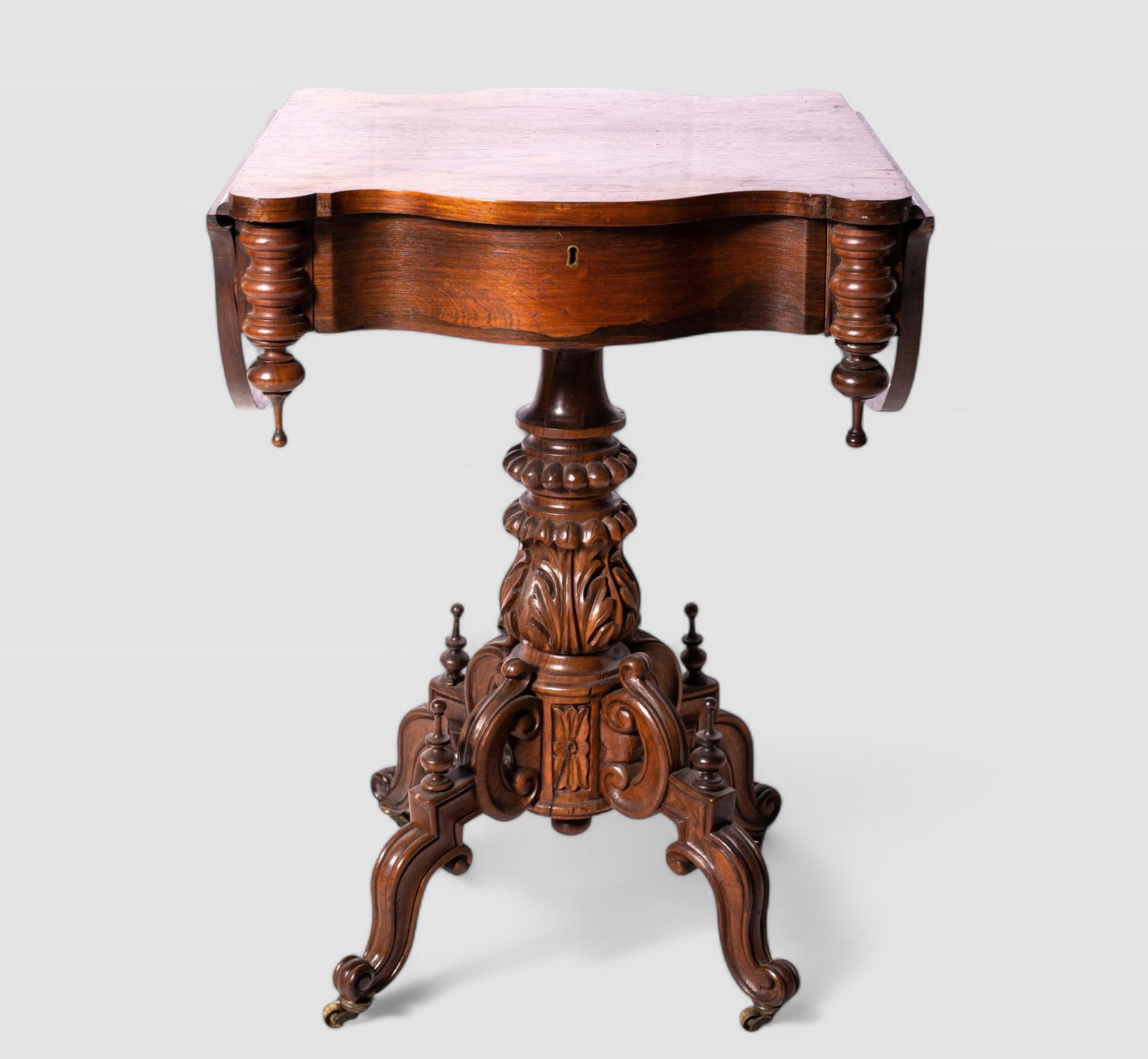 American Rosewood Renaissance Period Dop Side Stand: American Rosewood Renaissance Period Dop Side Stand. Circa 1865, scalloped front over one drawer flanked by tear drop finials. Top rests on turned, carved and beaded support resting on scrolled legs w