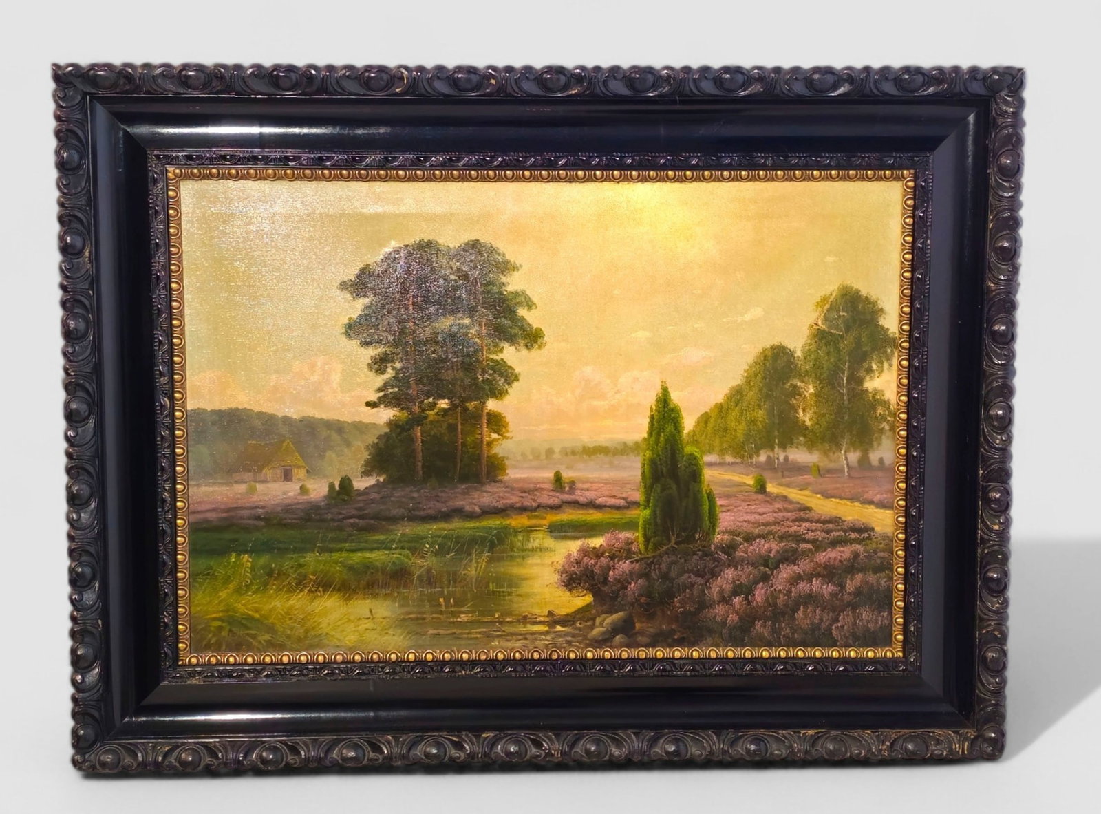 Mohlmann, Oil of Country Landscape: Oil on canvas, country scene with pond roadway, structure and trees. Signed Mohlmann lower left. Housed in ebony carved lacquered frame. Sight- 35 x 23 1/4 Frame- 45 1/2 x 34