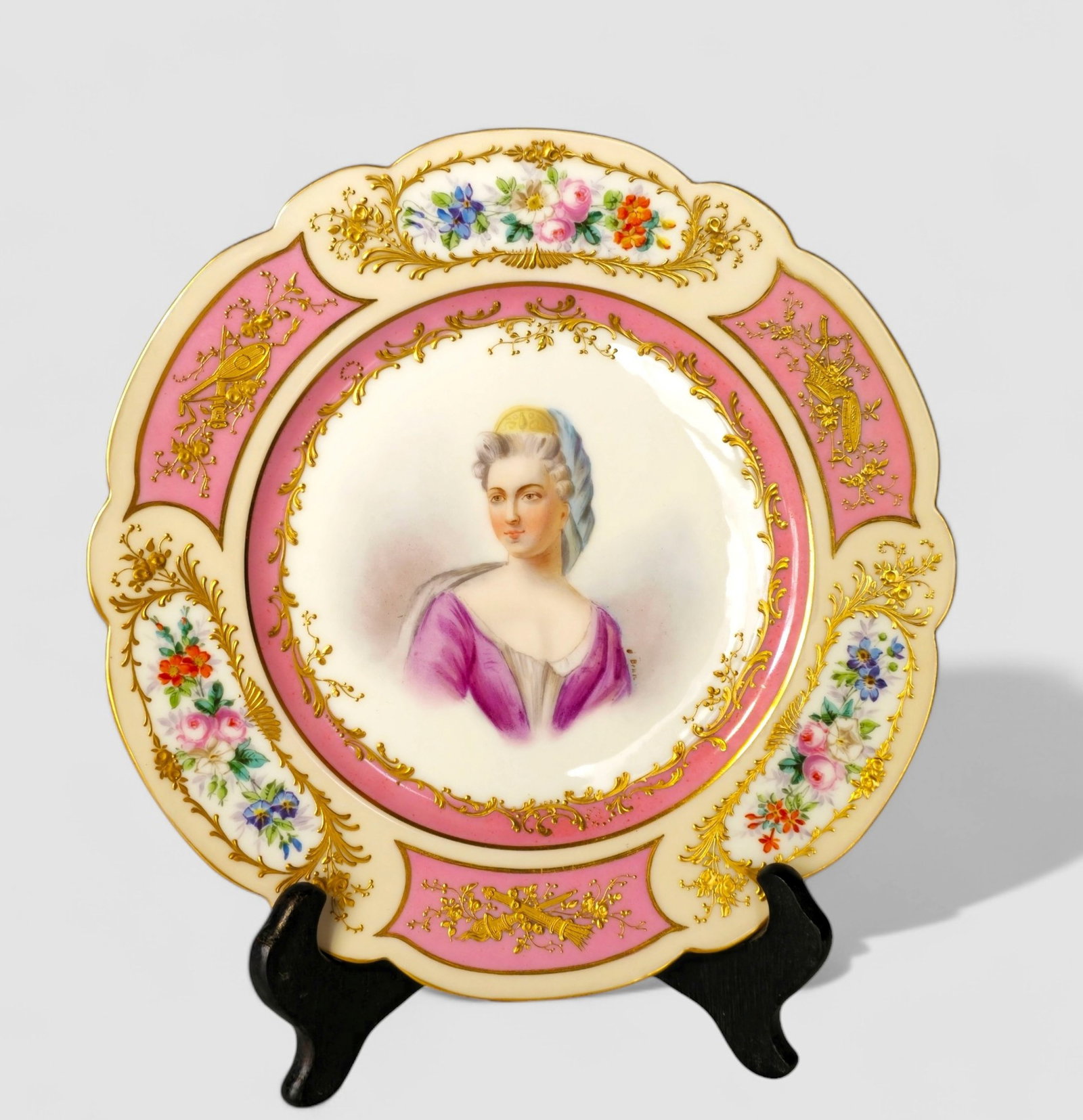 19th Century Porcelain Portrait Plate with Gilt Floral Border: 19th Century Porcelain Portrait Plate with Gilt Floral Border, France. Circa 1870-1890. Artist signed O. Brun. Manufacturer's marks to underside. 9 1/4 dia. Provenance: Larry Allee & Delbert E. Risse 