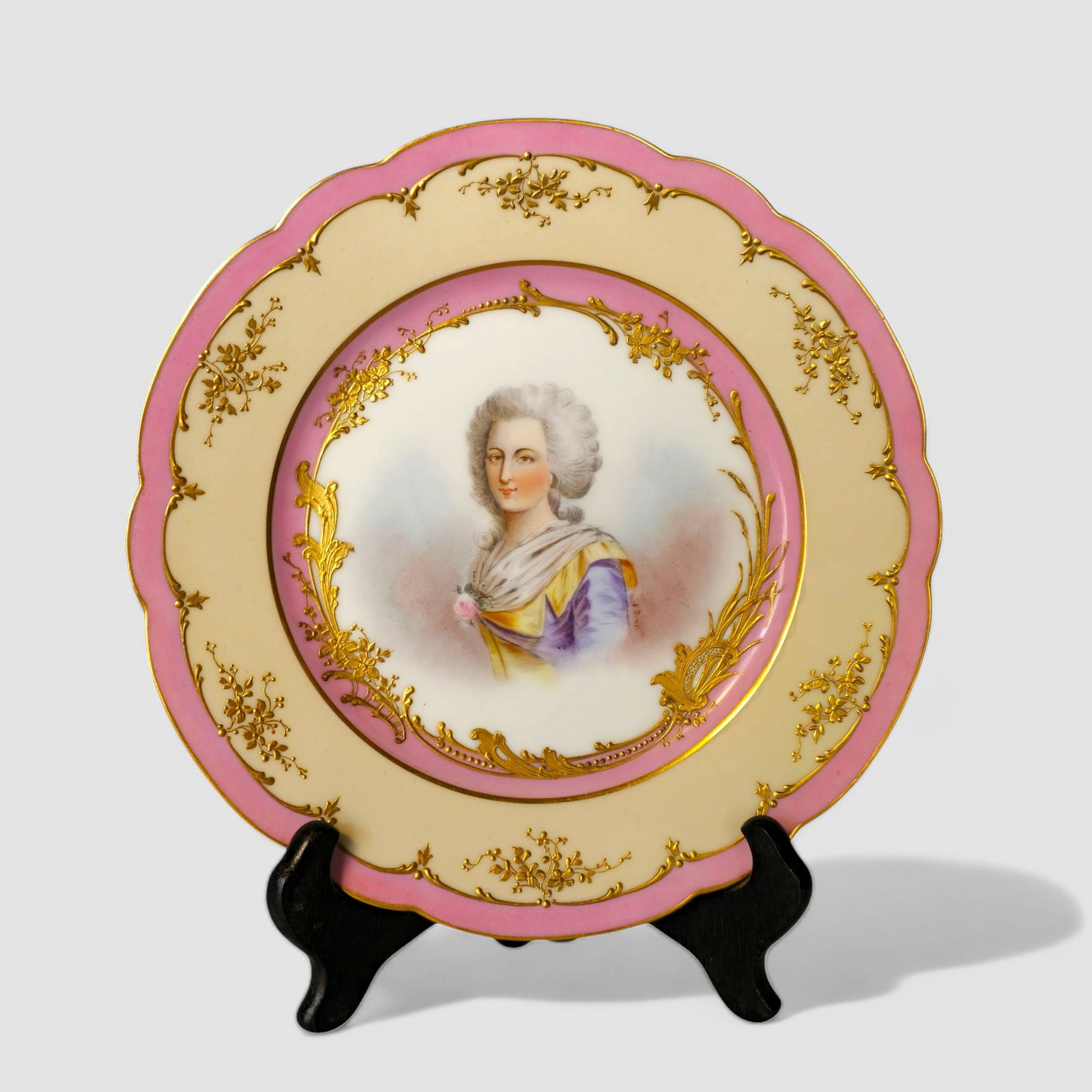 19th Century Porcelain Portrait Plate with Gilt Floral Border: 19th Century Porcelain Portrait Plate with Gilt Floral Border, France. Circa 1870-1890. Artist signed O. Brun. Manufacturer's marks to underside. 9 1/4 dia. Provenance: Larry Allee & Delbert E. Risse