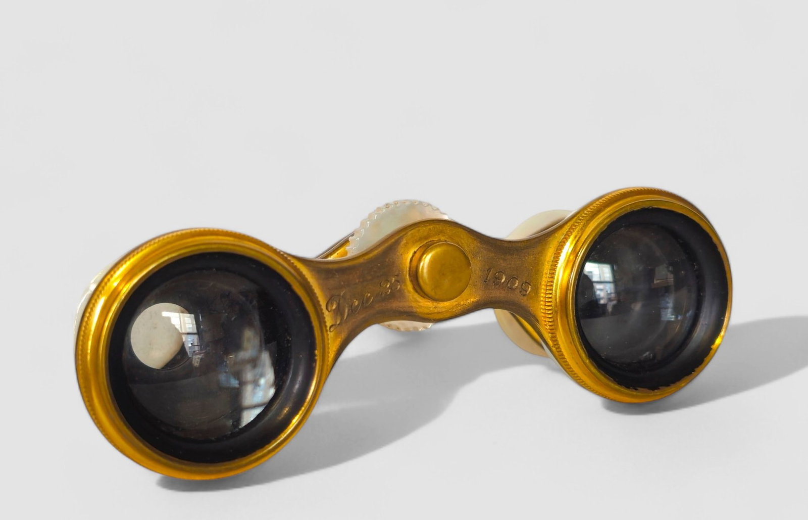 French Mother of Pearl Opera Glasses: French Mother of Pearl Opera Glasses, circa 1909. Purchased at Loring Andrews, Cincinnati, Ohio. Given as a Christmas present on December 25, 1909. Le Maire Fabt. Paris. 3 1/2w x 1d x 1 1/4h