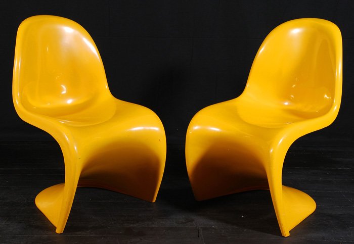 Verner Panton (1926-1998): Pair of vintage "The Panton Chair." Hard to find in yellow. Impressed Herman Miller mark to underside of both. Size 19W x 21D x 33H .