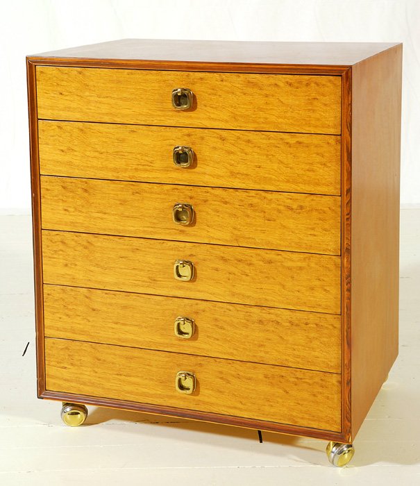 Edward Wormley: Six drawer chest on casters, natural English oak and rosewood, Dunbar #6744C. Brass "H" pulls, original label. Former property of Dorothy Liechty, secretary for the President of Dunbar, Grover Springe