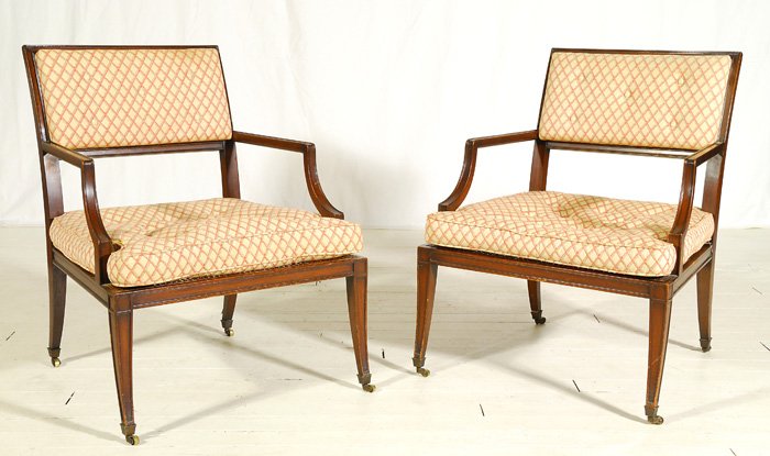 Grosfeld House: Pair of cane seat arm chairs. Original label and upholstery (removable seat cushion). Great detail and lines. One loose caster. 26.5w x 26d x 33h