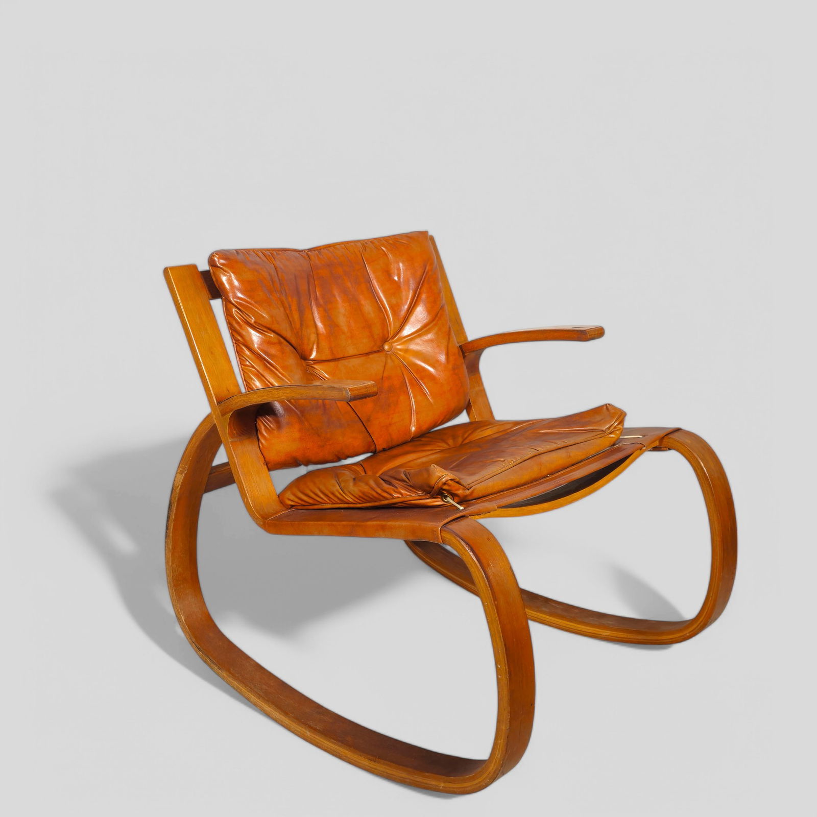 George Mulhauser (Attribution) Plycraft Sling Rocking Chair: George Mulhauser (Attribution) Plycraft Sling Rocking Chair, USA, 1970's. Oak and vinyl. 29w x 32 1/2d x 34h.