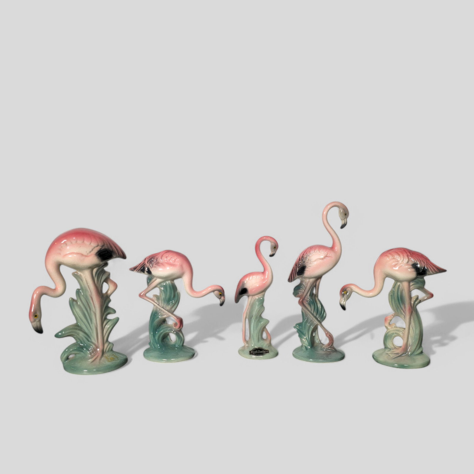 Assembled Brad Keeler L.A. California Pottery Flamingos: Assembled Brad Keeler L.A. California Pottery Flamingos, USA, 1940's. Manufacturer's label to one. Each signed to underside. Glazed pottery. Tallest- 3w x 2d x 8 1/2h Smallest- 2 1/2w x 1 3/4d x 6 1/4