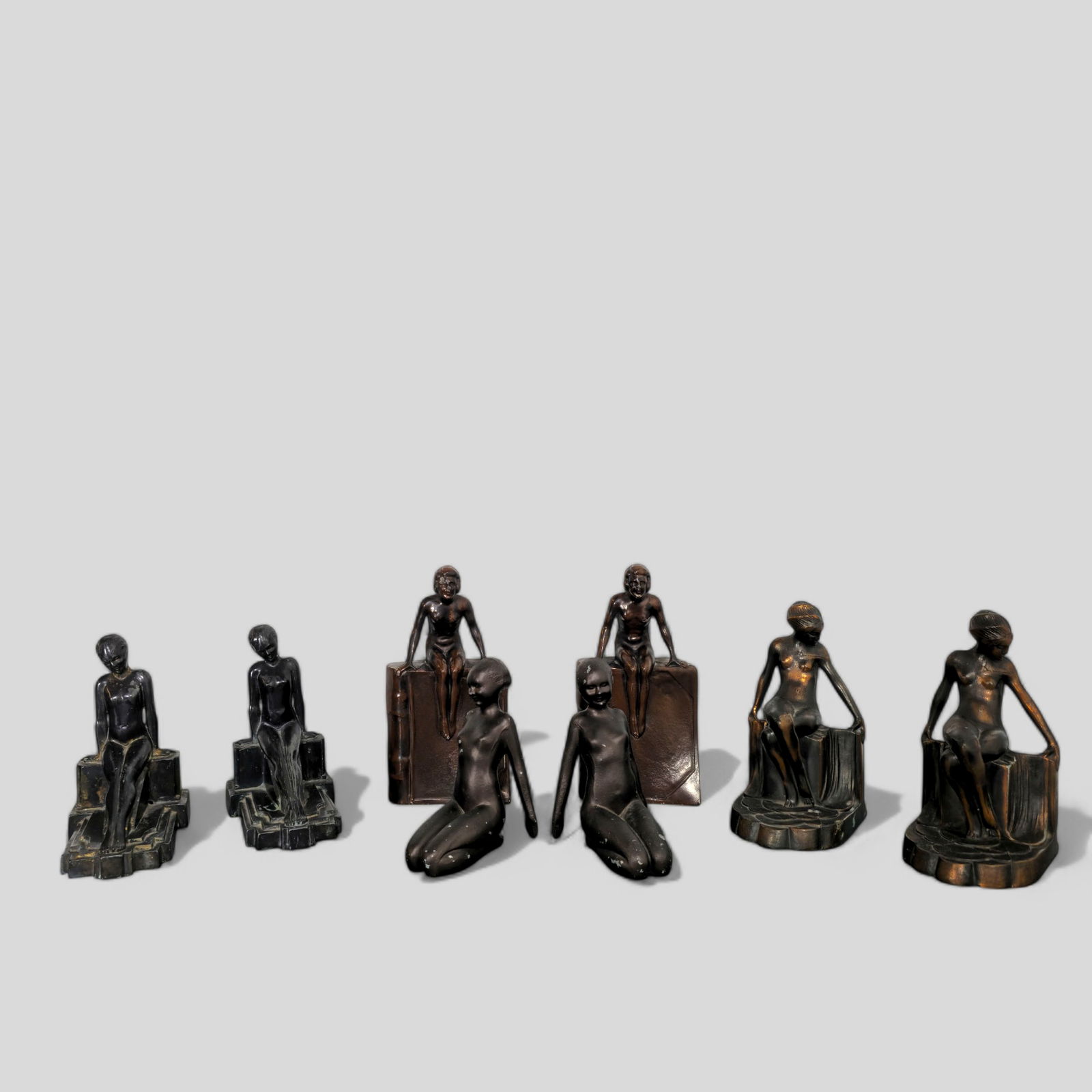 Assembled Art Deco Figural Bookends: Assembled Art Deco Figural Bookends, (4) pairs. 1920-1930. Littletown Hardware and Foundry Co. 4 14w x 2 1/2d x 8 3/8h. Sitting Nude Bookends marked No. 56. 4w x 4 1/2d x 7 1/4h. Frankart Inc Reclinin