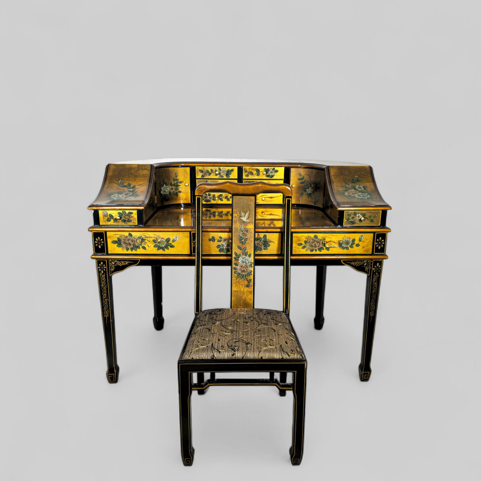 Maitland Smith Style Carlton Desk & Chair: Maitland Smith Style Carlton Desk & Chair, 1970's. Gold leaf over wood with floral motif and flying birds. Top has six center drawers flanked by two hinged doors. Two pencil drawers on the ends. Bases