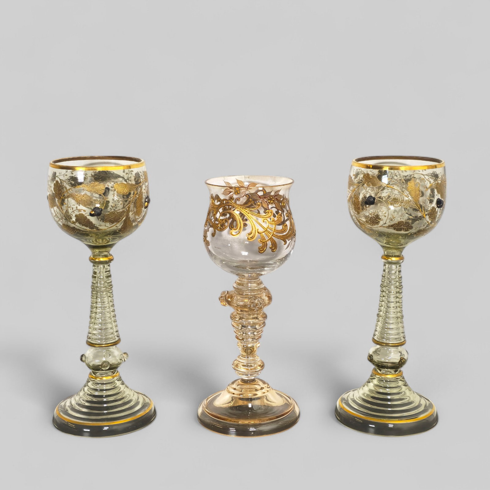 Moser Wine Glasses with Raised Decoration: Moser Wine Glasses with Raised Decoration, green glass with raised gilt leaf enamel design and high relief acorns and jewels. Single Moser wine glass with gilt and enamel decoration. Applied flower bu