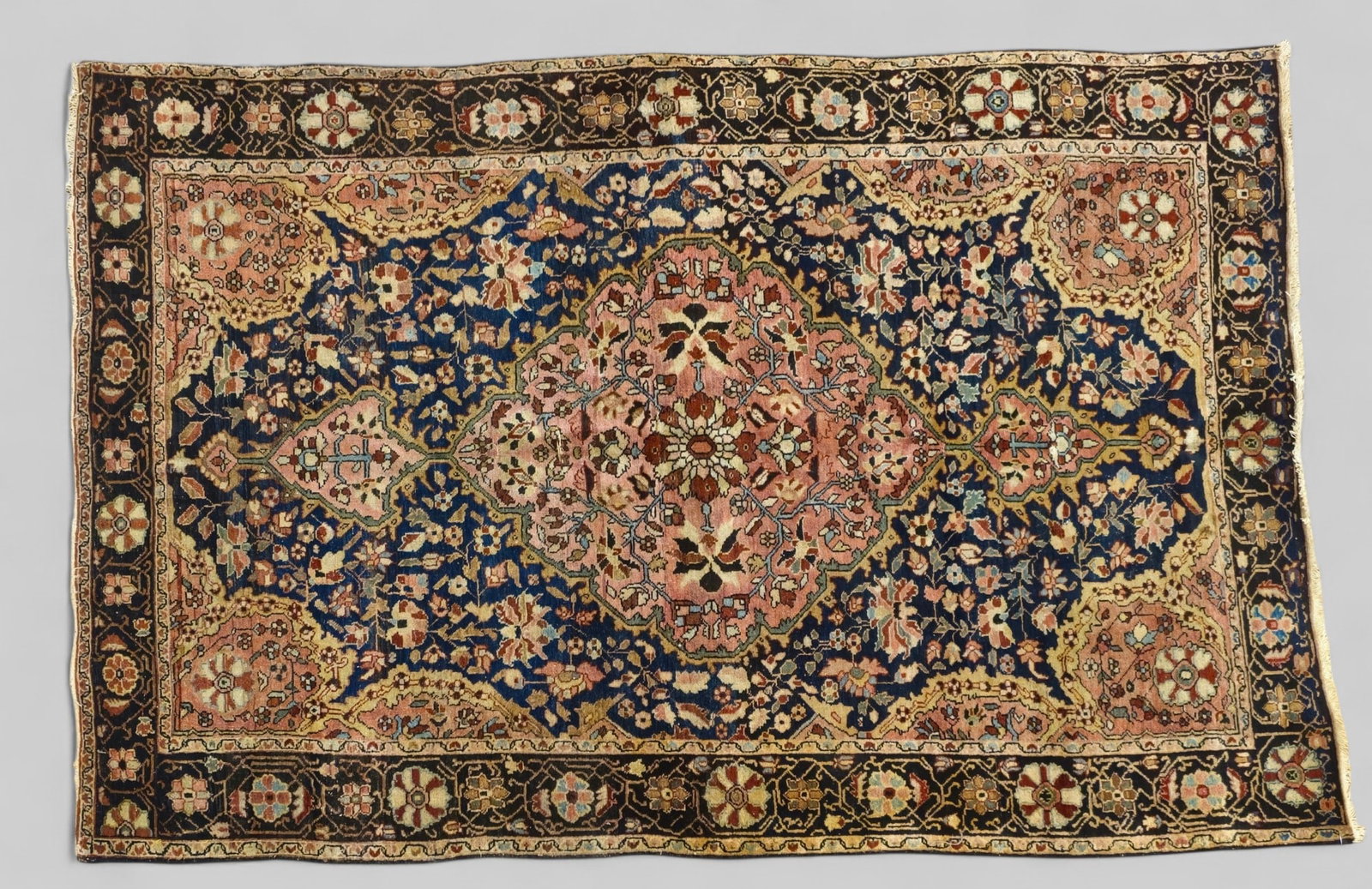 Persian Mashehad Are Rug 1910: Persian Mashehad Are Rug, circa 1910. All over garden design over a blue field. Rose center ovoid medallion and multiple layer borders. 4' 3 1/2" x 6' 6"