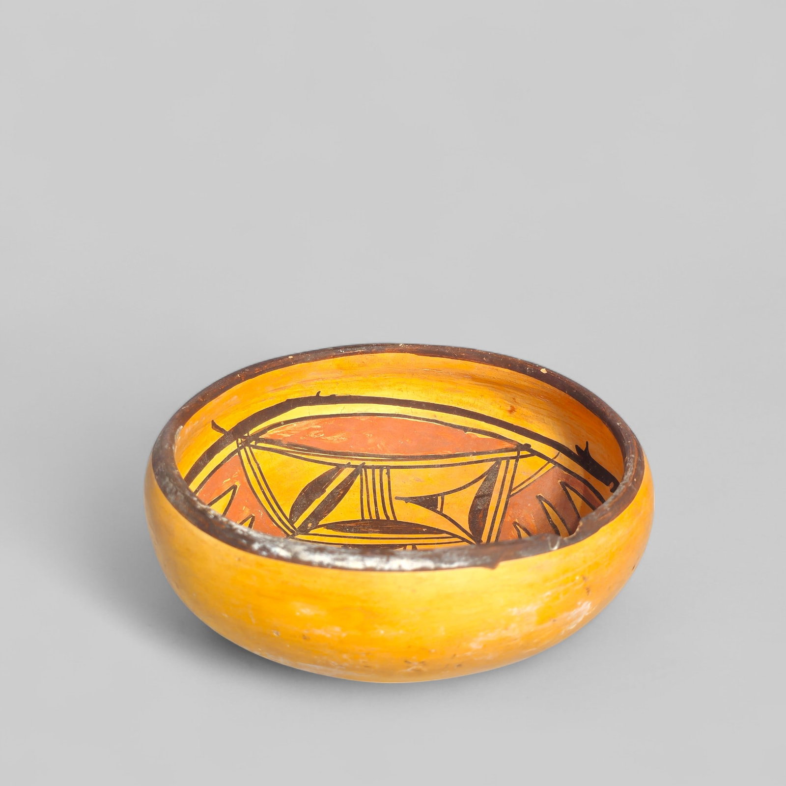 Hopi Pueblo Native American Pottery Bowl: Late 19th to early 20th century Hopi Pueblo Native American pottery bowl. Hand painted with geometric bird design. 6 3/8dia x 2 5/8h