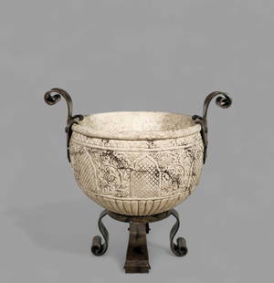 Italian Stone Planter with Iron Baroque Style Base: Italian Stone Planter with Iron Baroque Style Base, 20th century, Italy. Stone planter with high relief floral motif. Scrolled iron legs and handles. 24w x 17 3/4d x 23h
