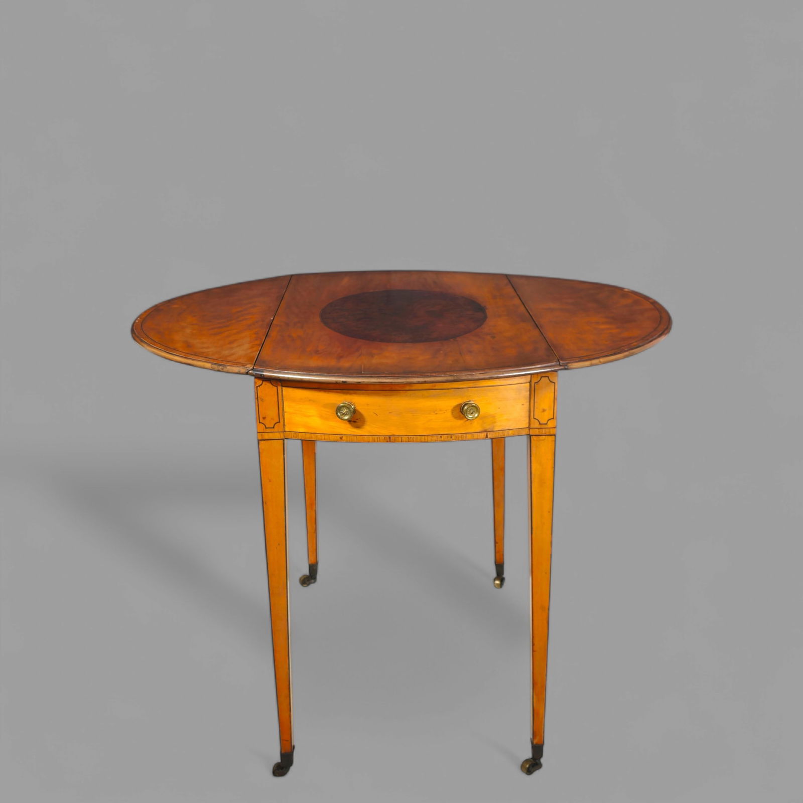 19th Century Mahogany Inlaid Pembrook Table: 19th Century Mahogany Inlaid Pembrook Table, circa 1820-1840. Mahogany with maple and rosewood inlay. Thumb molded top over bow front drawer and dummy drawer. Turned brass pulls. Square tapering legs