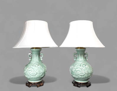 Chinese Celedon Double Handle Table Lamps: Chinese Celedon Double Handle Table Lamps, pair. High relief floral motif and low relief lotus leaf. Double scrolled handles. Mounted to shaped bases. Vase- 10 1/2dia x 16 3/4h Overall -30 1/2h