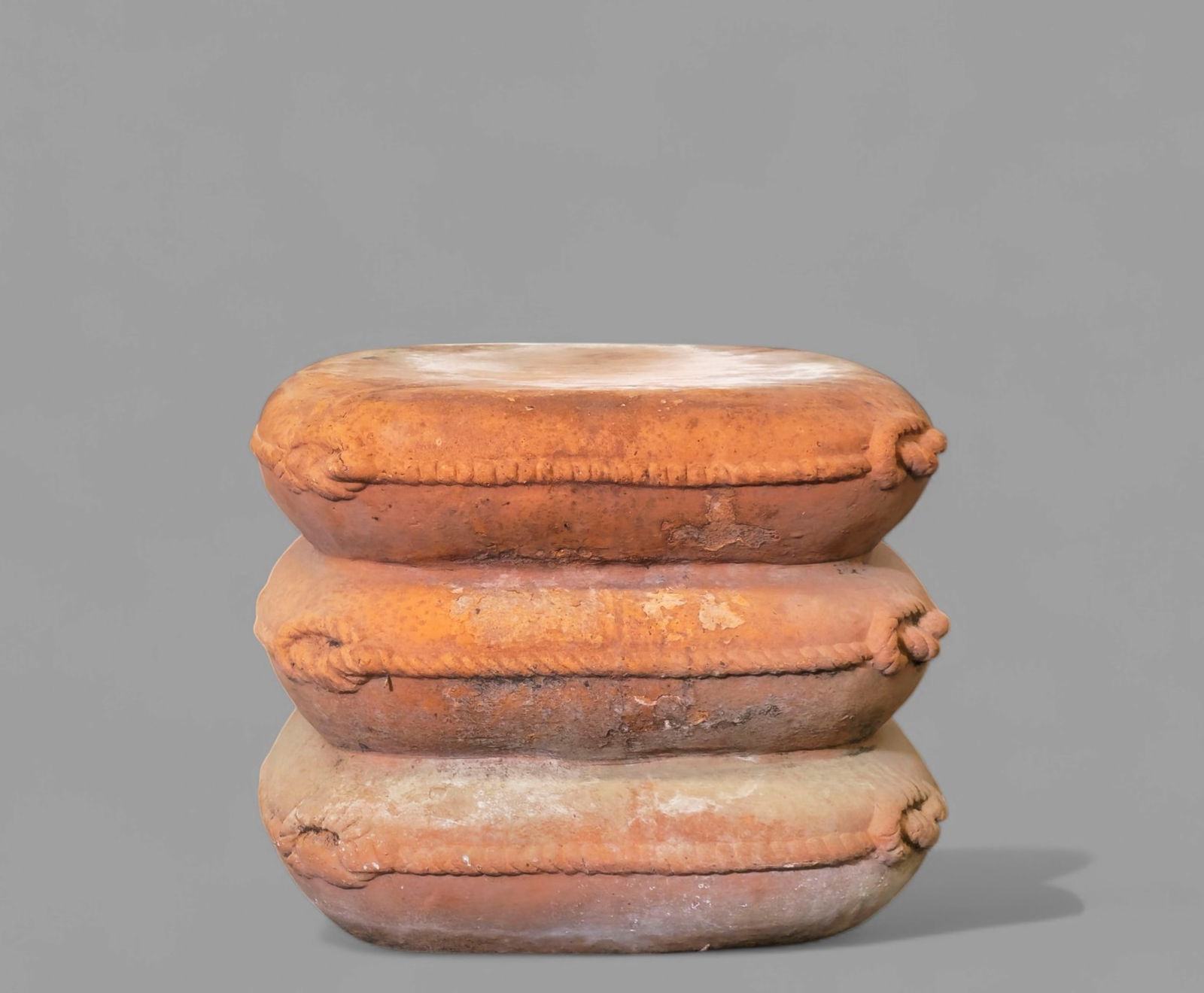 Italian Tuscany Terracotta Pillow Stack Pedestal: Italian Tuscany Terracotta Pillow Stack Pedestal, 20th century. Stack of three pillows with wrapped piping. Manufacturer's mark to side. 15w x 15d x 13 1/2h