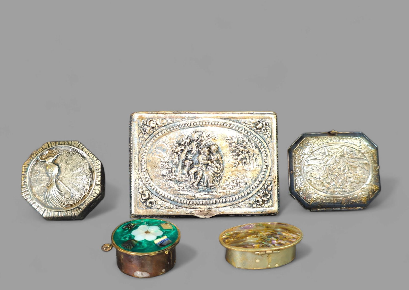 Assembled 19th Century Sterling & Continental Silver Boxes: Assembled 19th Century Sterling & Continental Silver Boxes. Continental cigarette box with hinged lid. Hand chased high relief courting couple. Mexican sterling and stone pill box. Continental silver