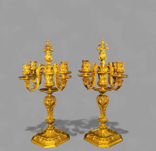 19th Century Rococo Revival Gilt Bronze Candelabras: 19th Century Rococo Revival Gilt Bronze Candelabras, circa 1880. French or Italian. Five branch candelabras with hand chases scaled amrs. Candle holders and support have urn form. Center support has c