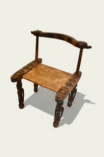 West African Senufo Tribal Chief Chair: Tribal chief chair, 20th century. Curved back with runed supports, plank seat with carved side runners. Chair rests on carved African woman figures.