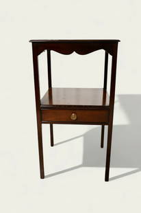 Saybolt Clelan Sheraton Style Mahogany Stand: Saybolt Clelan Sheraton Style Mahogany Stand. Philadelphia, PA. Square top with shaped aprons. Square supports with lower shelf and drawer. Manufacturer's label to drawer. 15 3/4w x 15 3/4d x 28 3/4h.