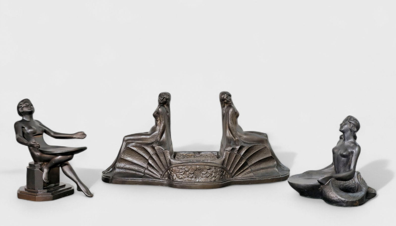 Frankart Art Deco Lamp Base Plus: Frankart Art Deco Lamp Base Plus, (3) pieces total, USA, 1920's-1930. Frankart lamp base, nude reclining lady card holder. Mermaid card holder. Patinated metal. 12 1/2w x 3 3/4d x 6h