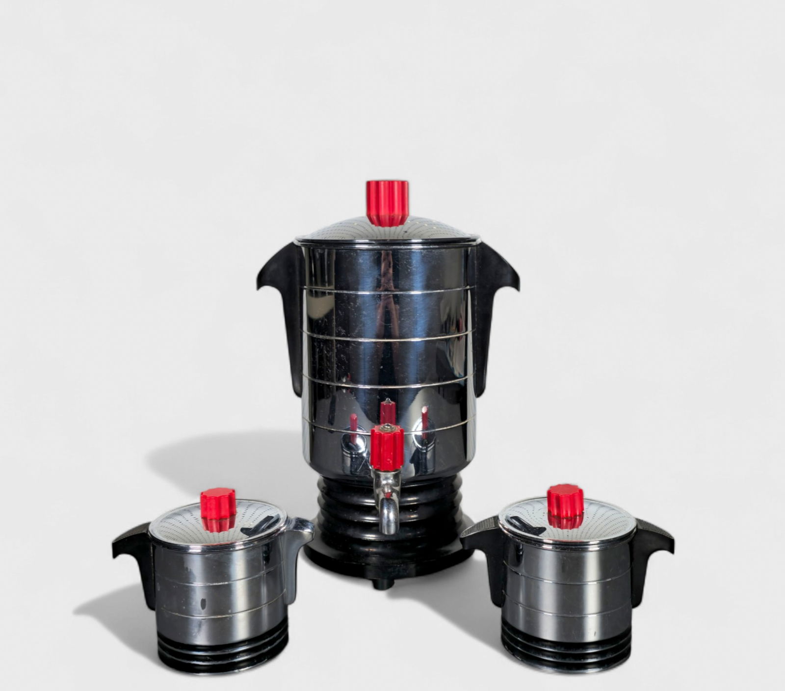 "Hotpoint" Coffee Set: "Hotpoint" Coffee Set, coffee pot, creamer and sugar, USA, 1934. Manufacturer's marks to each element. Chrome plated metal, enameled metal and Bakelite. (3) Pieces total. 8w x 8d x 11 3/4h