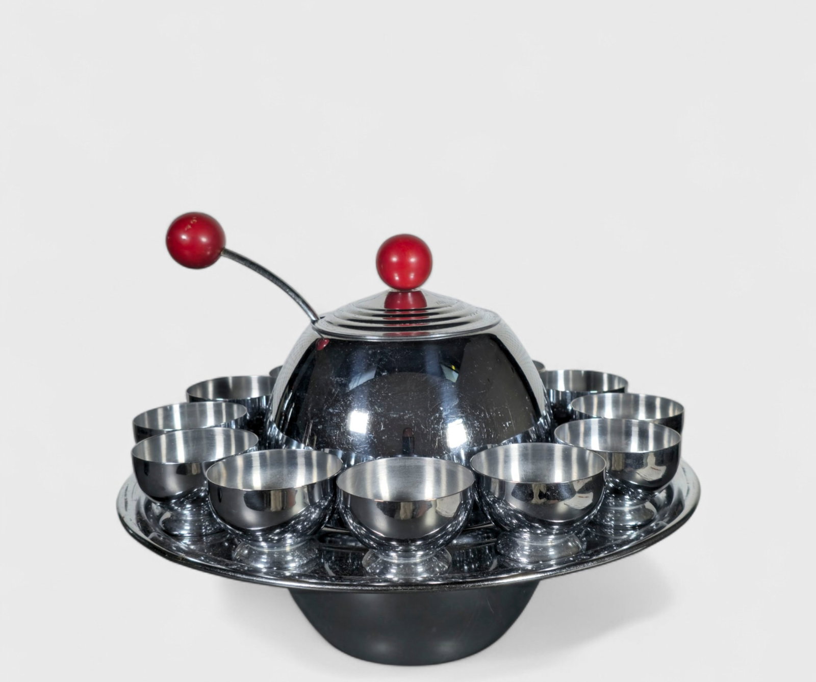 Lehman Brothers Art Deco Saturn Ring Punch Bowl & Chase "Gaiety" Cups: Lehman Brothers Art Deco Saturn Ring Punch Bowl & Chase "Gaiety" Cups, Punch bowl circa 1938. Chase cups circa 1934, set of (12). Manufacturer's mark to each element. Chrome plated metal and Bakelite.
