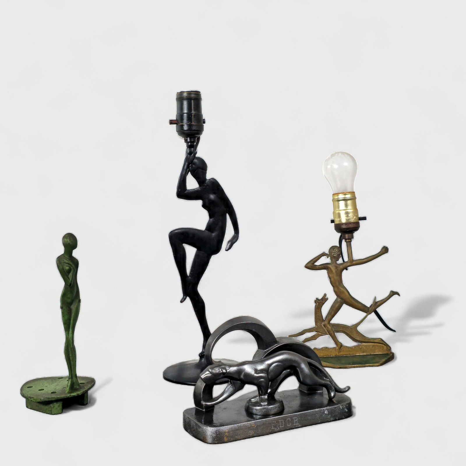 Frankart Flower Frog & Bookend, Art Deco Figural Table Lamps: Frankart Flower Frog & Bookend, Art Deco Figural Table Lamps, (4) pieces total. Bronze nude lady table lamp. Bronze nude dancer lamp. Frankart flower frog and Frankart bookend. Patinated bronze. (4) P