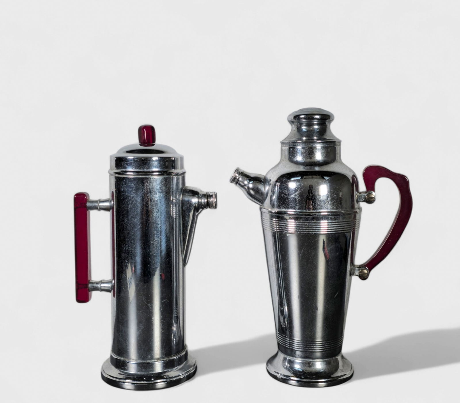 Art Deco Cocktail Shakers: Art Deco Cocktail Shakers, (2) total, USA, 1930's. Chrome plated stainless and Bakelite. 8 1/2w x 5d x 12 3/4h