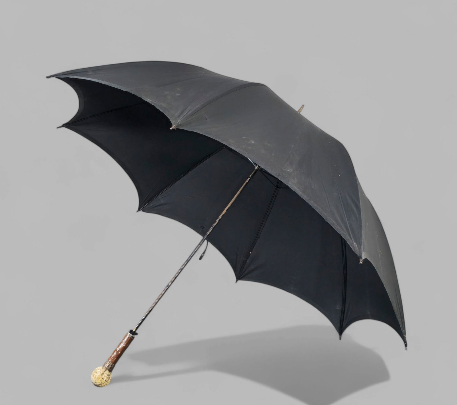 Intricately Carved Faces of the World Handle Umbrella (1 of 6)