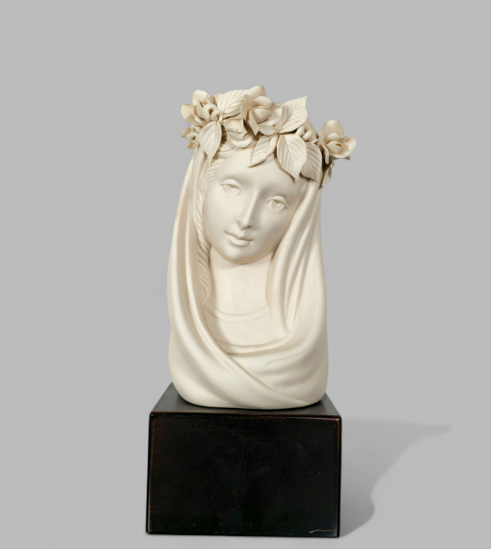 Cybis Porcelain Madonna: Cybis Porcelain Madonna. Elevated on black lacquered base. Manufacturer's marks to verso. 4 1/2w x 4 1/2d x 11 1/2h.