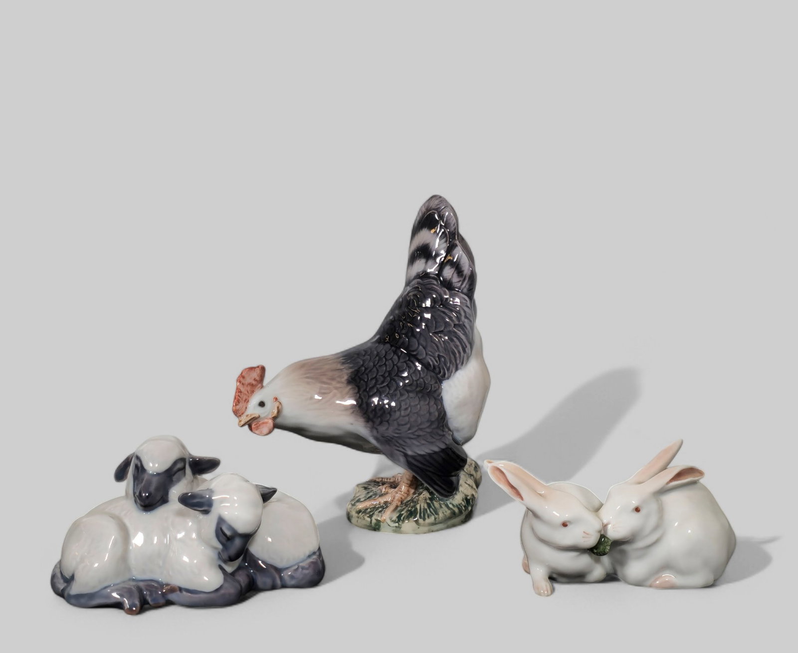 Assembled Royal Copenhagen Figurines: Assembled Royal Copenhagen Figurines. Chicken #024, Rabbits #065 and Sheep #137. Artist's and Manufacturer's mark to underside. 4 3/4 w x 5 5/8 h.