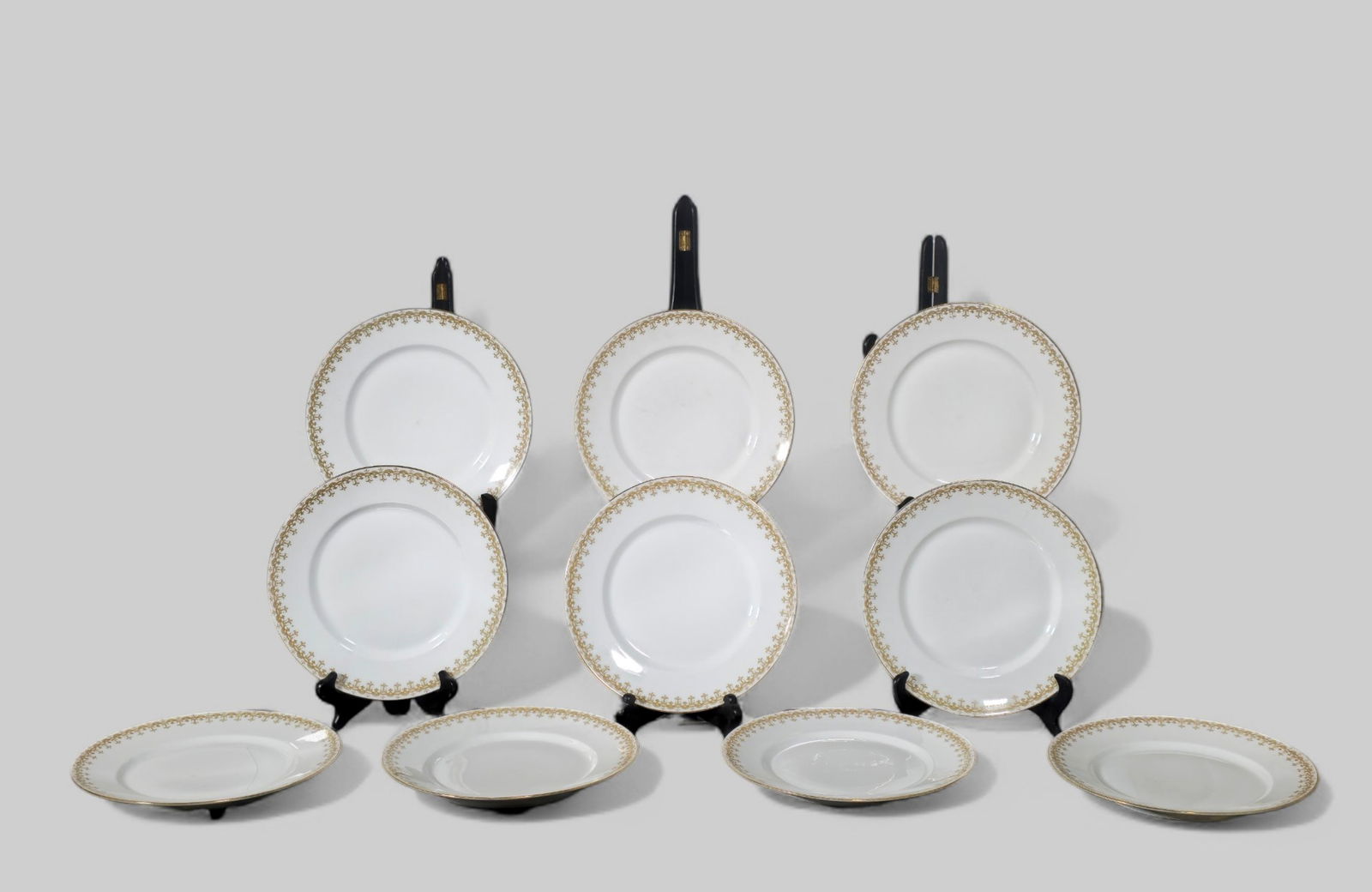 C. Ahrenfeldt Limoges Dinner Plates: C. Ahrenfeldt Limoges Dinner Plates. Set of 10. Green Garland ribbon style borders. Manufacturer's marks to underside. 9 3/4dia