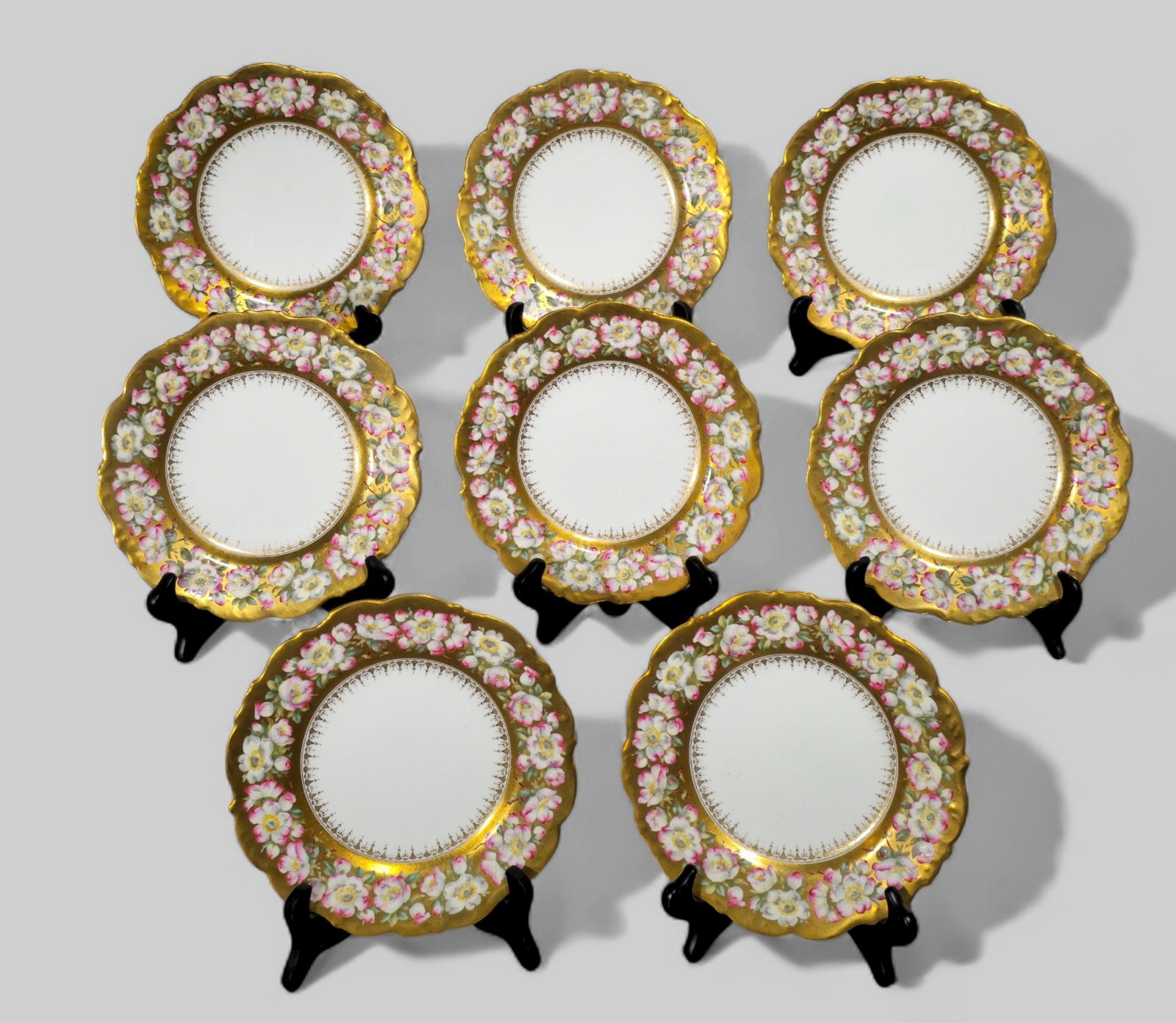 Cauldron porcelain floral and gilt plates: Cauldron porcelain floral and gilt plates. Set of 8. 1920's. manufacture's marks to underside. 9 Dia.