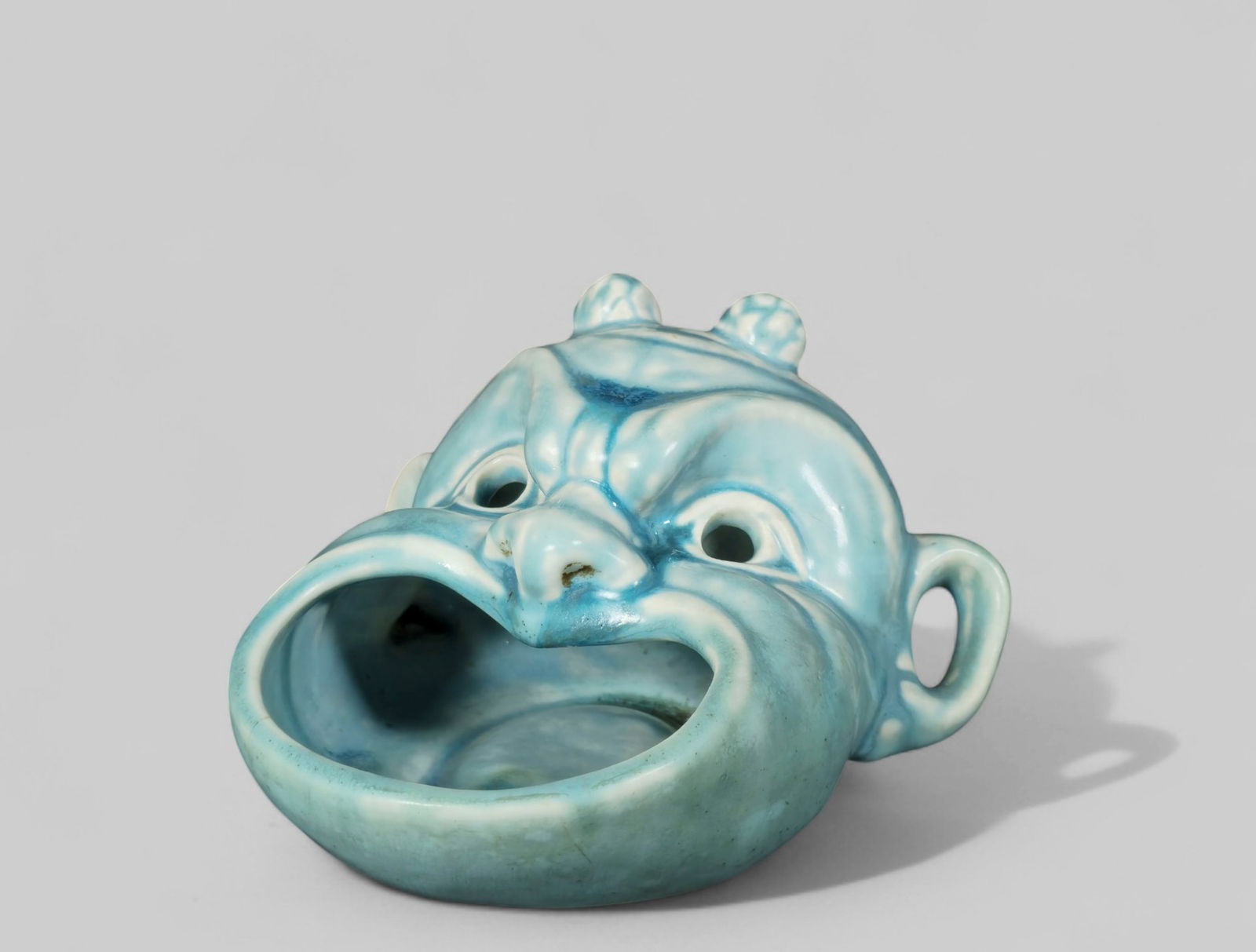 Rookwood Pottery Devil Music #2457: Rookwood Pottery Devil Music #2457. Date 1943. Blue Matte Glaze. RP logo, date and #2457 to underside.5 1/2 W x 5 1/2D x 3 1/2H.