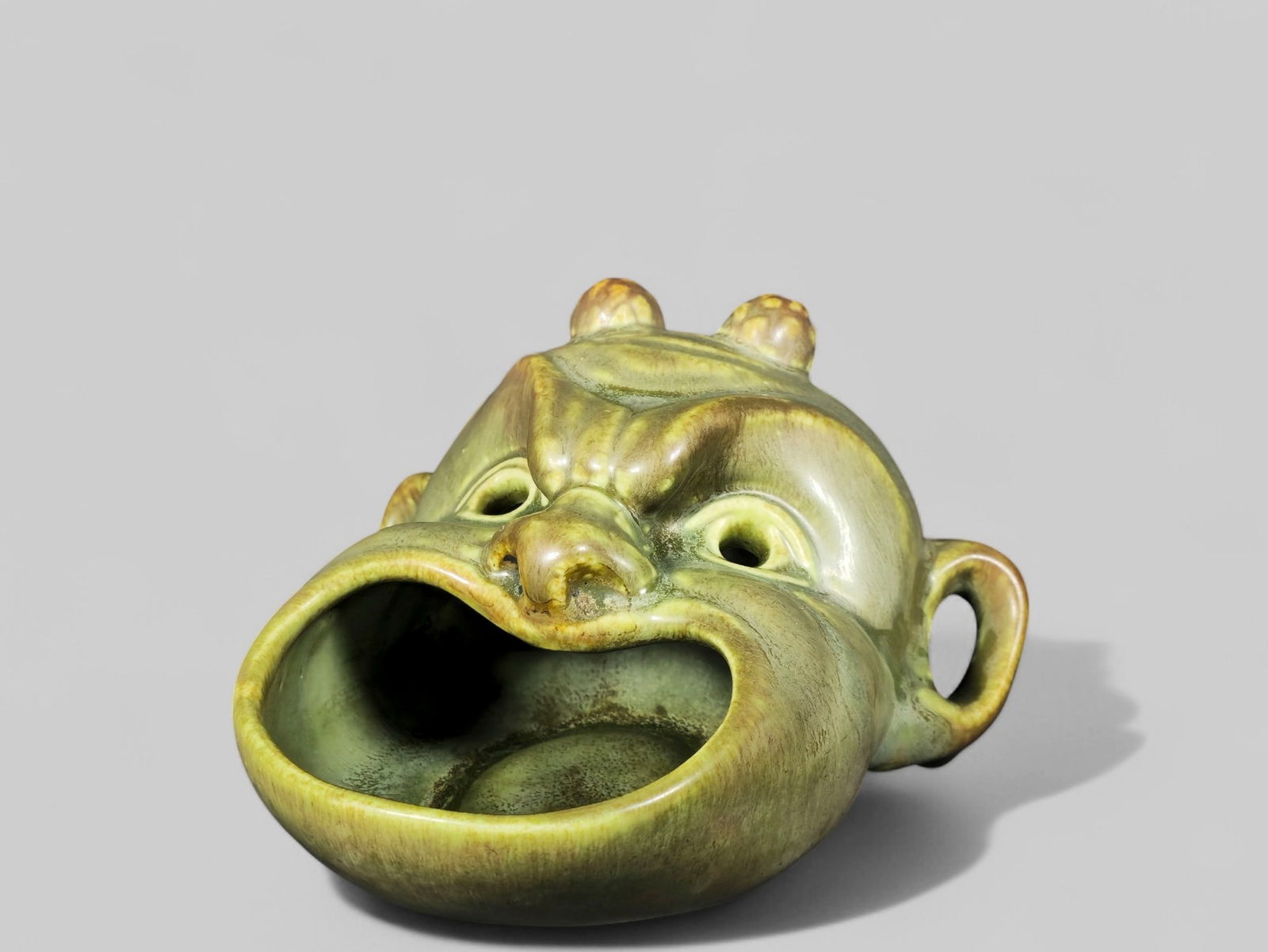 Rookwood Pottery Devil Music #2457: Rookwood Pottery Devil Music #2457. Date 1943. Green Matte Glaze. RP logo, date and #2457 to underside. 5 1/2W x 5 1/2 x 3 1/2H.