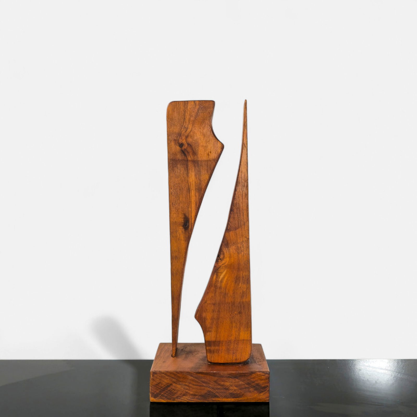 MCM Abstract Walnut Sculpture: Mid century modern walnut abstract sculpture. Resting on teak base. 7 1/2w x 5 3/4d x 19h