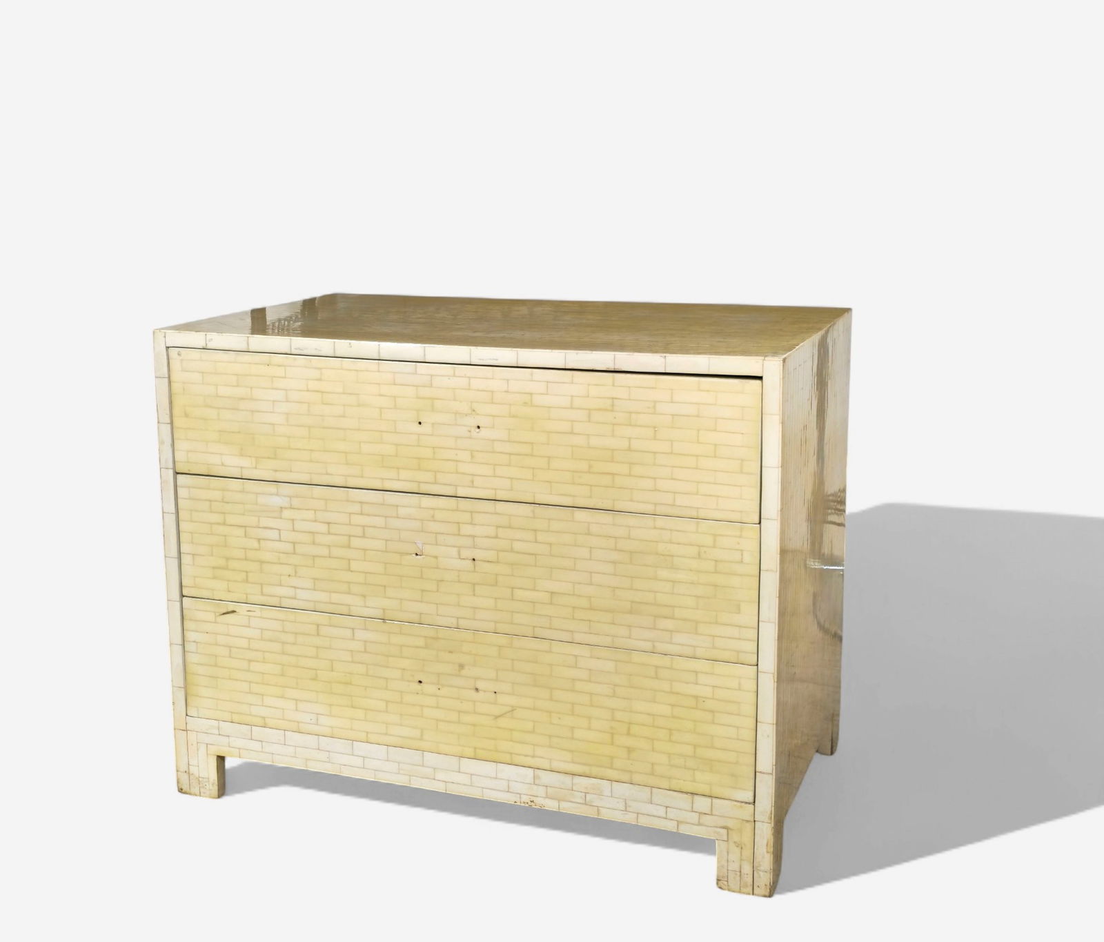 Karl Springer Style Tessellated Stone Three-Drawer Chest/ Cabinet: Mid-Century Modern three-drawer chest in the manner of Karl Springer, clad entirely in hand-laid tessellated bone veneer. The rectilinear form features clean, minimalist lines with subtle inset legs a