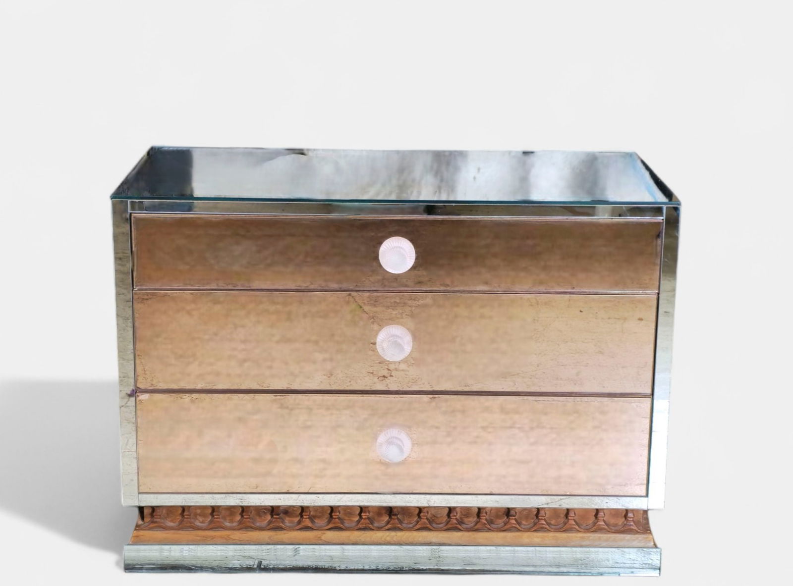 John Van Koert "Casa Del Sol" Chest/ Cabinet: Glamorous three-drawer mirrored chest by John Van Koert for Drexel "Casa Del Sol", featuring antiqued mirror panels with beveled edges and round frosted glass pulls. The case rests on a carved wood ba