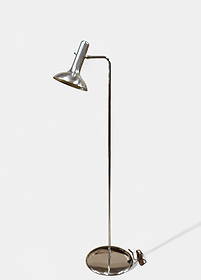 Mid-Century Modern Chrome Adjustable Floor Lamp: Sleek modernist floor lamp featuring a chrome-plated steel structure with pivoting shade and round weighted base. The clean, tubular form and minimalist design recall the work of Robert Sonneman and G