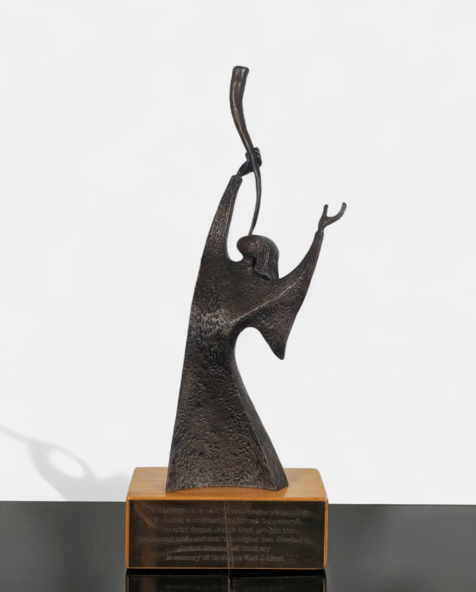 Herman Schwagereit Bronze Sculpture “Joshua”: Cast bronze quarter-size replica of Joshua, originally sculpted by Herman Schwagereit. Depicts a stylized robed figure blowing a shofar, rendered in an expressive, textured modernist form. Mounted on 