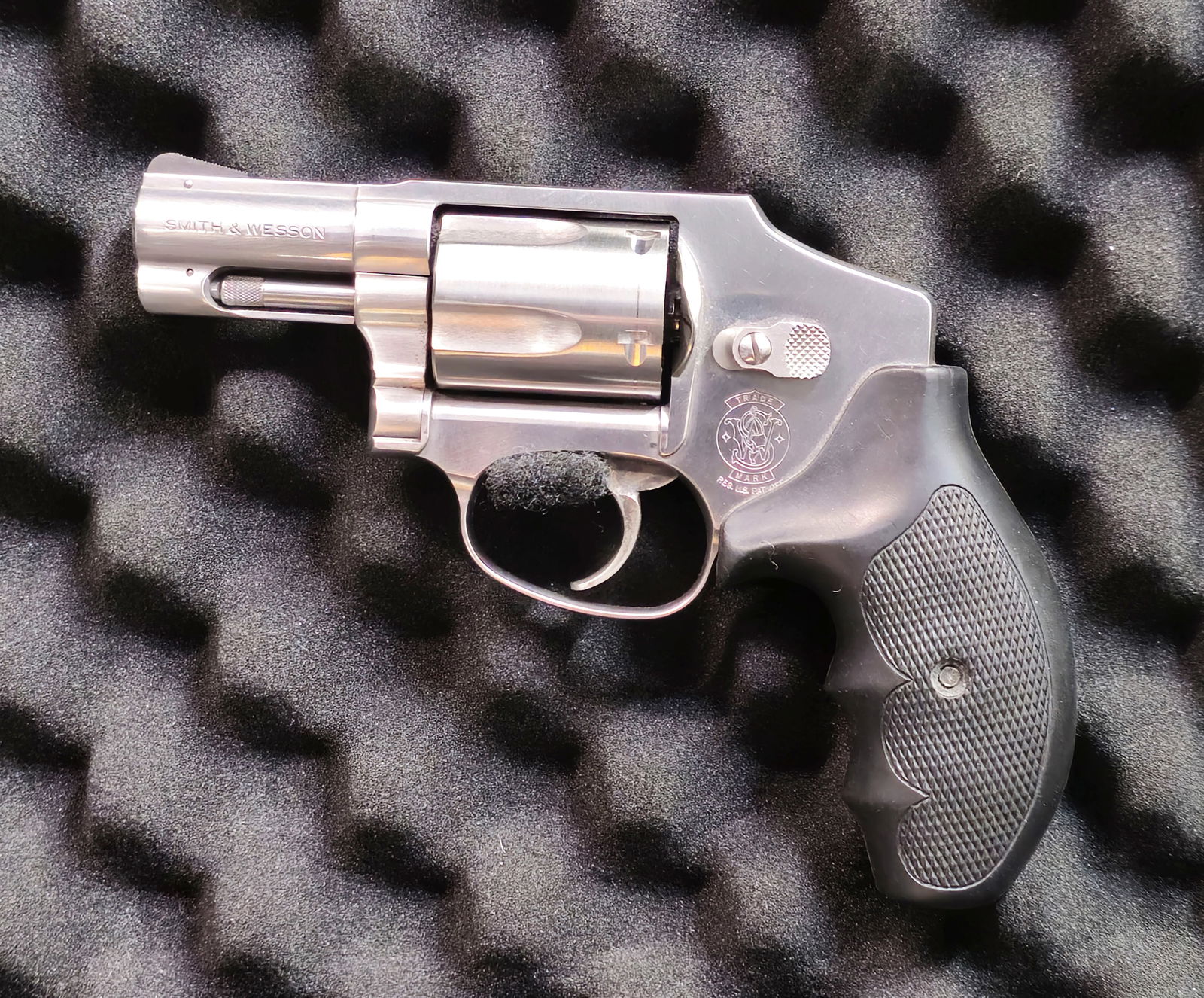 Smith & Wesson stainless Steel Double-action .357 Revolver: Smith & Wesson stainless steel double-action revolver,.357. Sn BUD9297. J-frame, with 5-shot fluted cylinder, short barrel, and factory rubber combat grips. Marked “SMITH & WESSON” and “MADE