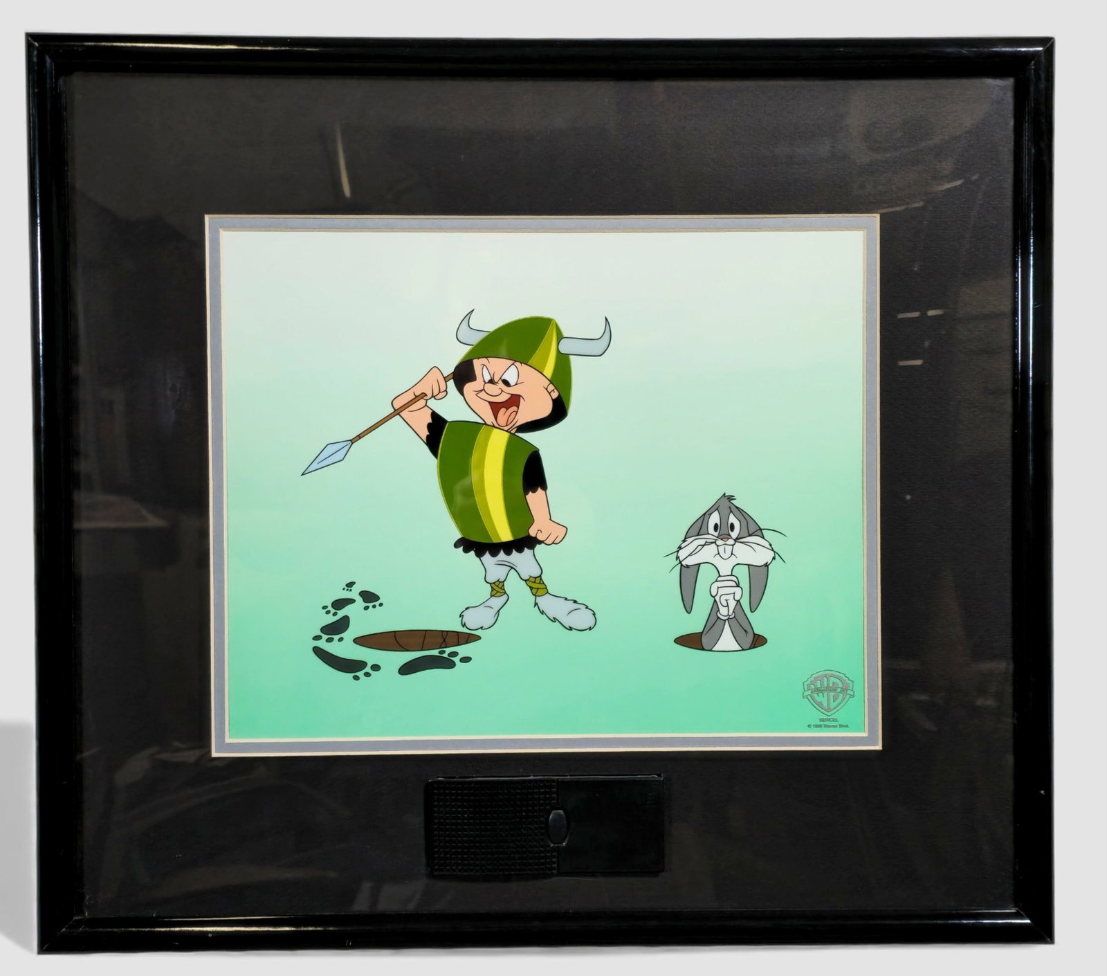 Warner Bros. Animation Art, autographed Sericel “Wabbit Twacks!" 1998: Warner Bros. Animation Art, Wabbit Twacks!, 1998 Sericel with voice-chip feature, depicting Elmer Fudd in Viking costume triumphantly brandishing a spear while Bugs Bunny peers nervously from a burrow