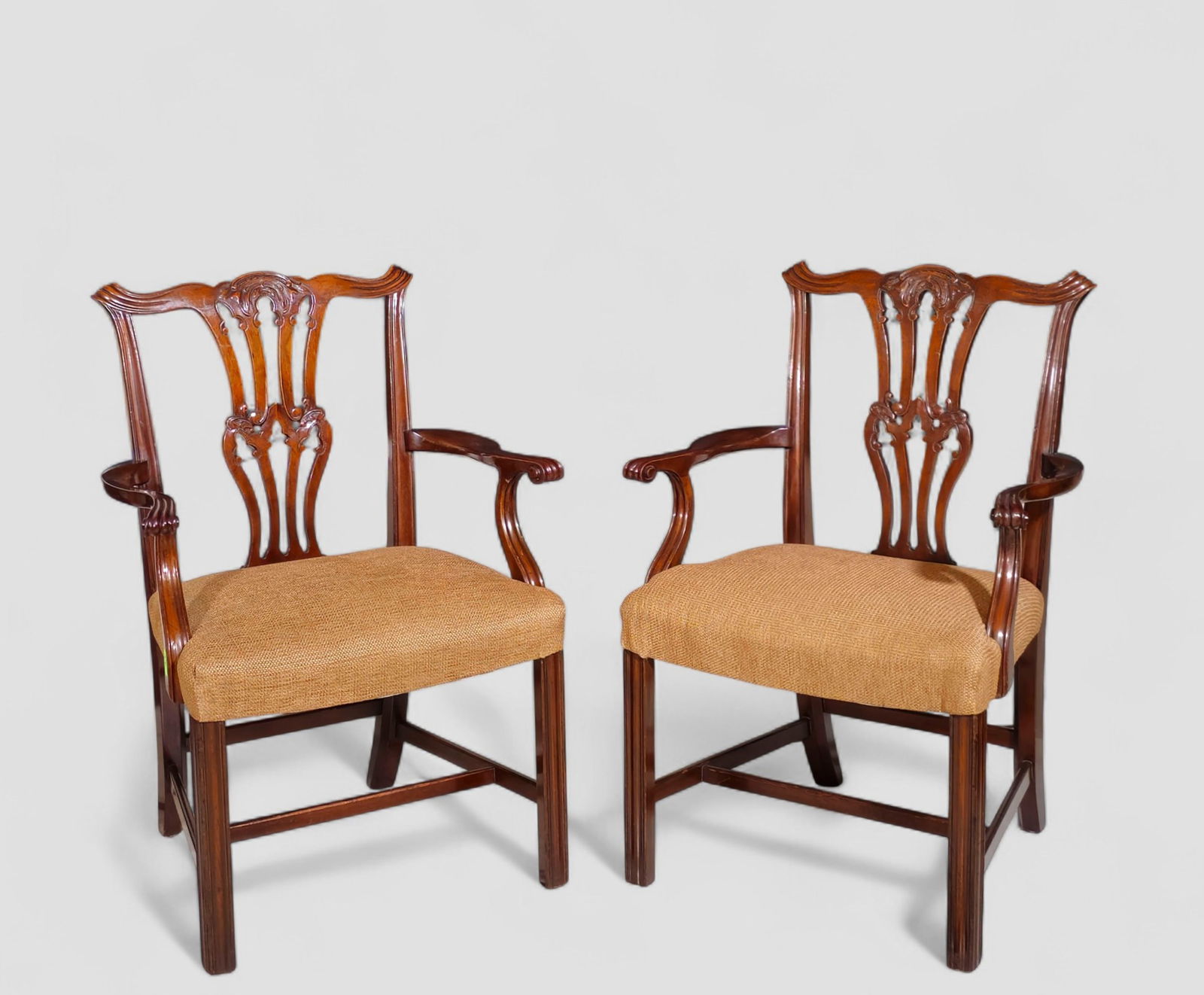 Baker Furniture Co. Centennial Mahogany Chippendale Style Arm Chairs: Baker Furniture Co. Centennial Mahogany Chippendale Style Arm Chairs. Ribbon crest over an open lattice back. Curved arms with scrolled ends and curved supports. Beautiful upholstered seat over straig