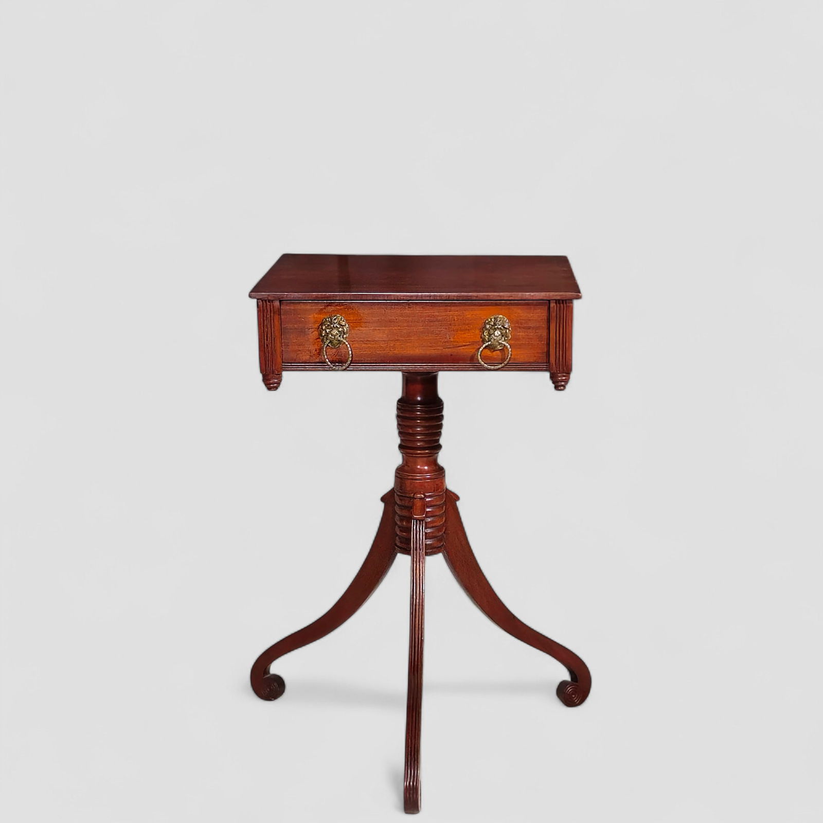 Early 19th Century Baltimore Mahogany One Drawer Table: Early 19th Century Baltimore Mahogany One Drawer Table. Circa 1810. Overhang top over one drawer with lion head ring pulls. Pine and ash secondary wood. Reeded triple curved legs, beehive corner