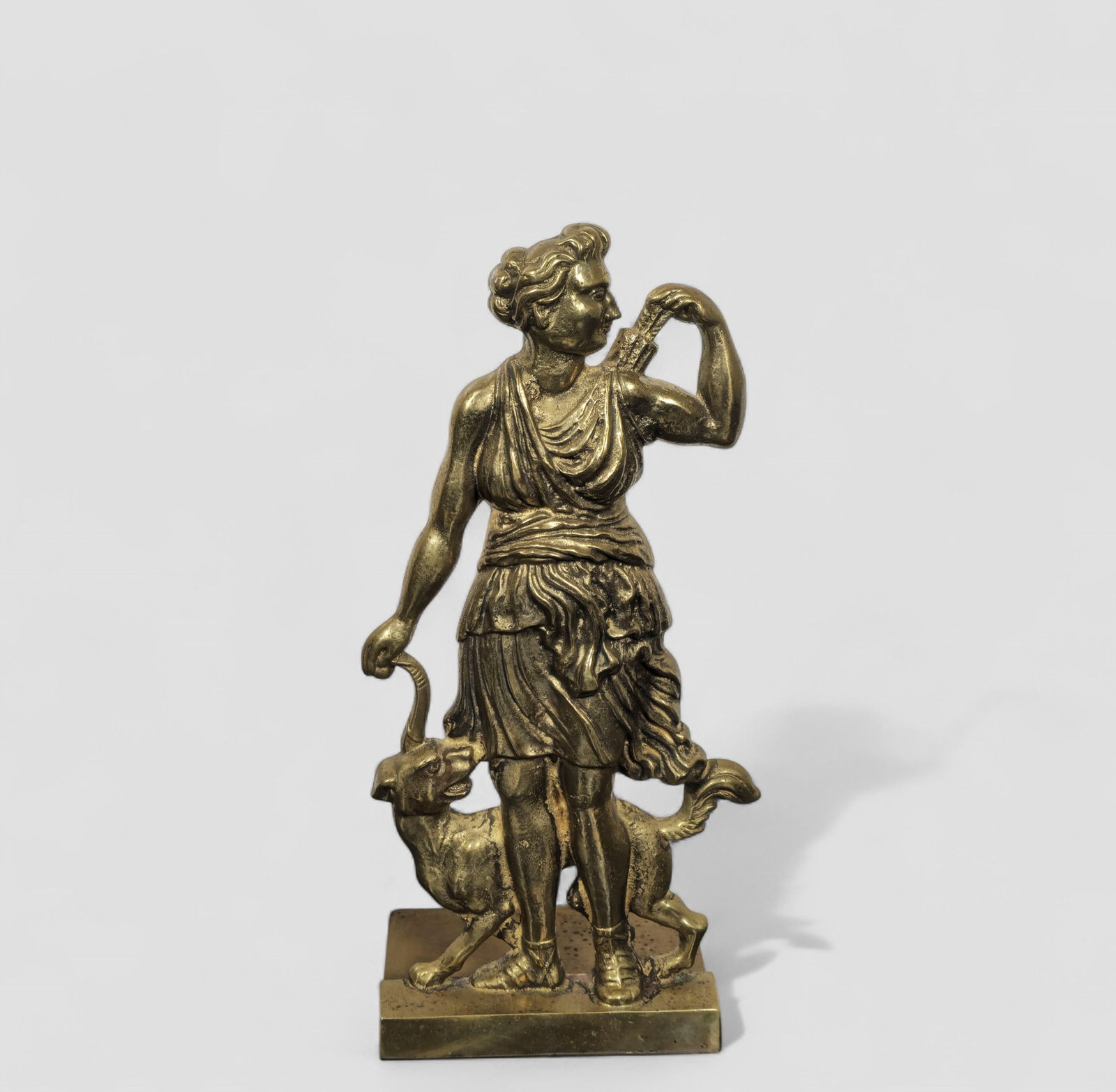Gilt Bronze Diana The Huntress Doorstop: Gilt Bronze Diana The Huntress Doorstop. Circa 1920s. Gilt cast bronze over an cast brass base. 5 1/2w x 4 1/4d x 11 1/4h.